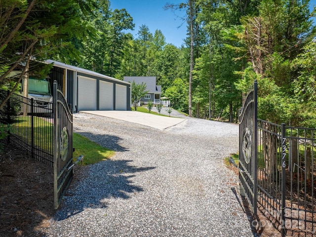 7376 NC-181 Hwy, Morganton, NC 28655 - view of dirt / gravel road featuring a gated entry and a view of trees