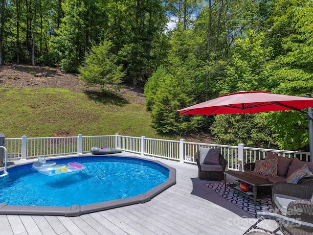 7376 NC-181 Hwy, Morganton, NC 28655 - view of pool featuring a wooden deck, an outdoor living space, and a view of trees