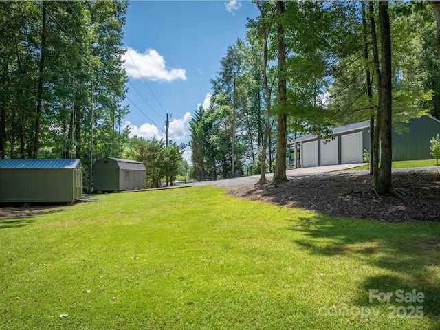 7376 NC-181 Hwy, Morganton, NC 28655 - view of green lawn with a shed