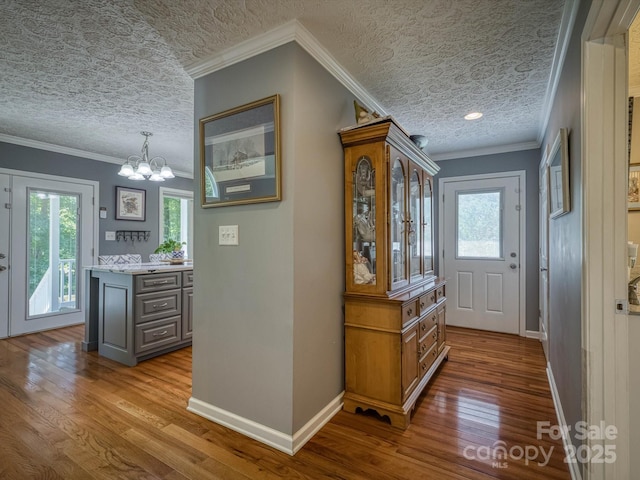 7376 NC-181 Hwy, Morganton, NC 28655 - foyer with a textured ceiling, wood finished floors, a chandelier, and ornamental molding