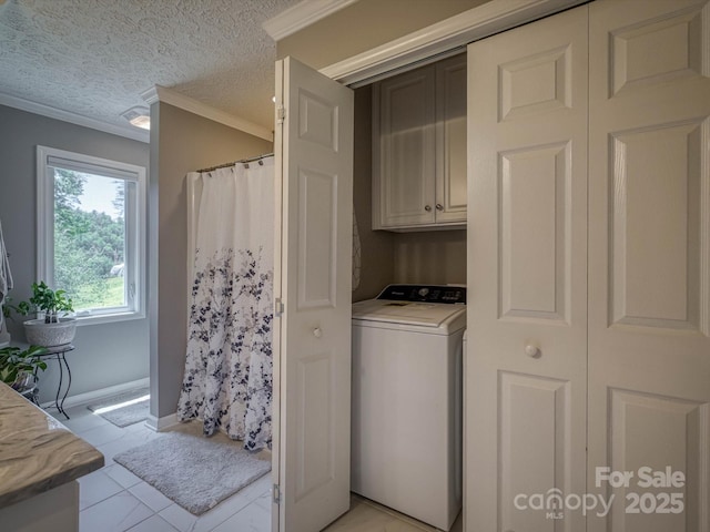 7376 NC-181 Hwy, Morganton, NC 28655 - laundry area featuring cabinet space, ornamental molding, washer / clothes dryer, and light tile patterned floors