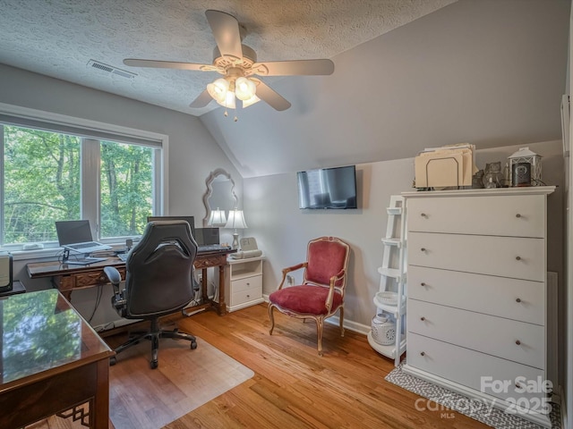 7376 NC-181 Hwy, Morganton, NC 28655 - office space featuring a ceiling fan, vaulted ceiling, light wood finished floors, and a textured ceiling