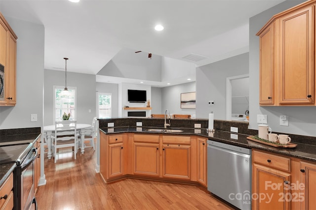 20234 Middletown Rd, Cornelius, NC 28031 - kitchen with stainless steel appliances, light wood-type flooring, dark stone counters, hanging light fixtures, and recessed lighting