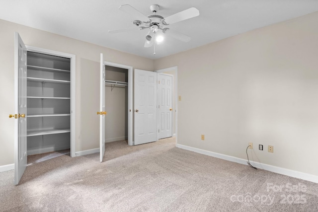 2705 N Center St Unit 76, Hickory, NC 28601 - unfurnished bedroom featuring multiple closets, carpet flooring, and a ceiling fan