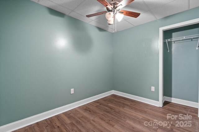 2705 N Center St Unit 76, Hickory, NC 28601 - unfurnished bedroom featuring a paneled ceiling, a closet, dark wood-style floors, and ceiling fan