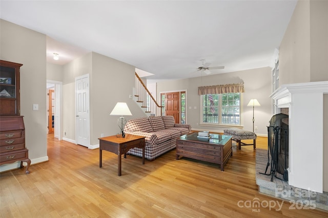 12 Woodvine Ln, Lake Wylie, SC 29710 - living area with light wood-style flooring, stairway, a ceiling fan, and a fireplace
