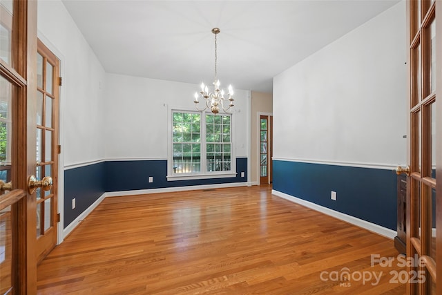12 Woodvine Ln, Lake Wylie, SC 29710 - unfurnished room with a chandelier and wood finished floors