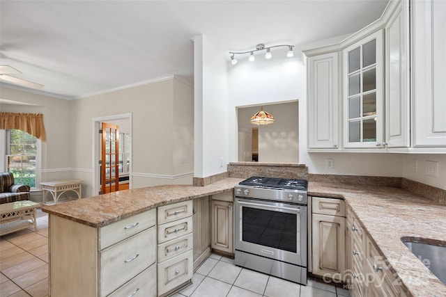 12 Woodvine Ln, Lake Wylie, SC 29710 - kitchen with gas range, light tile patterned flooring, glass insert cabinets, and crown molding