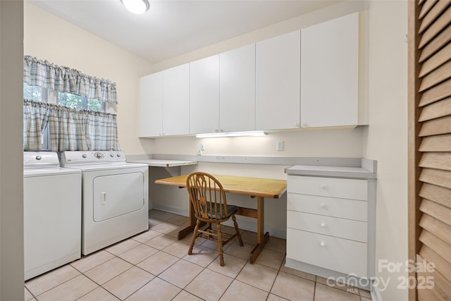 12 Woodvine Ln, Lake Wylie, SC 29710 - laundry area featuring washing machine and dryer, cabinet space, light tile patterned flooring, and a desk