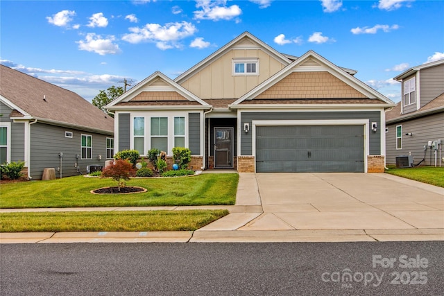 117 Cup Chase Dr, Mooresville, NC 28115 - craftsman inspired home featuring brick siding, concrete driveway, board and batten siding, an attached garage, and a front yard