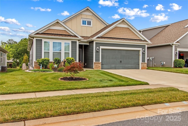 117 Cup Chase Dr, Mooresville, NC 28115 - craftsman-style home with concrete driveway, board and batten siding, a garage, a front lawn, and brick siding