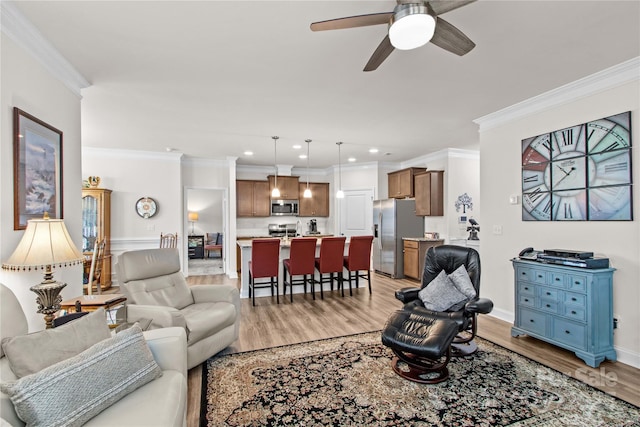 117 Cup Chase Dr, Mooresville, NC 28115 - living room featuring light wood finished floors, ceiling fan, ornamental molding, and recessed lighting