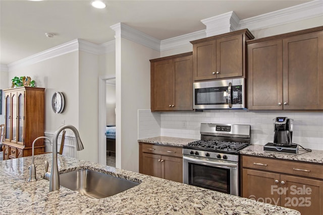 117 Cup Chase Dr, Mooresville, NC 28115 - kitchen featuring stainless steel appliances, crown molding, decorative backsplash, and light stone counters