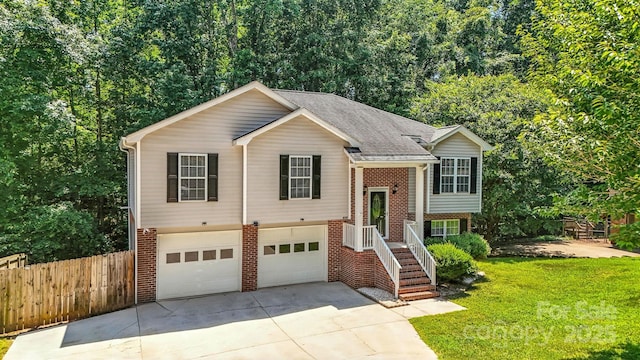 824 17th Avenue Dr SE, Hickory, NC 28602 - bi-level home featuring brick siding, concrete driveway, an attached garage, and a shingled roof