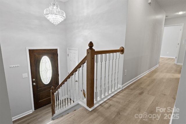 824 17th Avenue Dr SE, Hickory, NC 28602 - foyer featuring wood finished floors and a chandelier