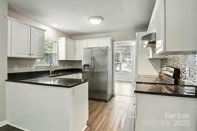824 17th Avenue Dr SE, Hickory, NC 28602 - kitchen featuring stainless steel refrigerator with ice dispenser, ventilation hood, a peninsula, white cabinetry, and wood finished floors