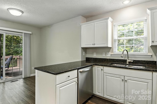 824 17th Avenue Dr SE, Hickory, NC 28602 - kitchen featuring stainless steel dishwasher, a textured ceiling, white cabinetry, a peninsula, and dark wood-style flooring
