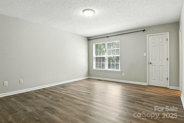 824 17th Avenue Dr SE, Hickory, NC 28602 - unfurnished room featuring a textured ceiling and wood finished floors