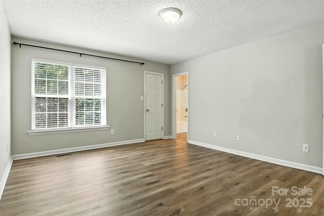 824 17th Avenue Dr SE, Hickory, NC 28602 - spare room with wood finished floors and a textured ceiling