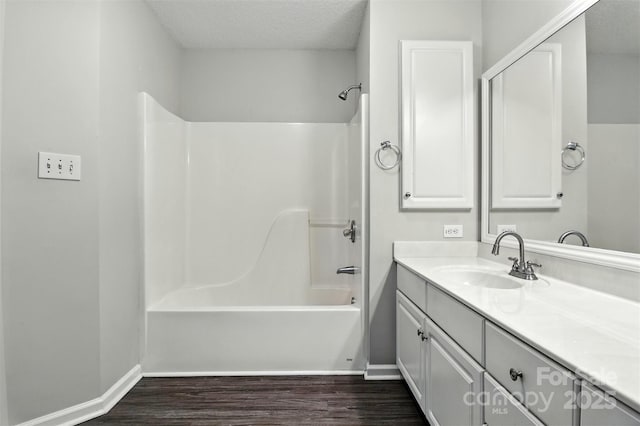 824 17th Avenue Dr SE, Hickory, NC 28602 - bathroom featuring vanity, tub / shower combination, wood finished floors, and a textured ceiling