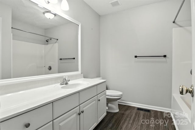 824 17th Avenue Dr SE, Hickory, NC 28602 - bathroom with vanity, washtub / shower combination, and wood finished floors