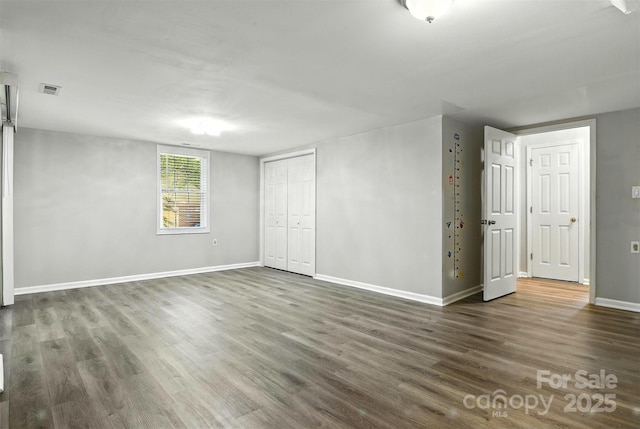 824 17th Avenue Dr SE, Hickory, NC 28602 - unfurnished bedroom with wood finished floors and a closet