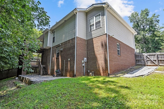824 17th Avenue Dr SE, Hickory, NC 28602 - back of house featuring brick siding, a patio, a wooden deck, and stairs
