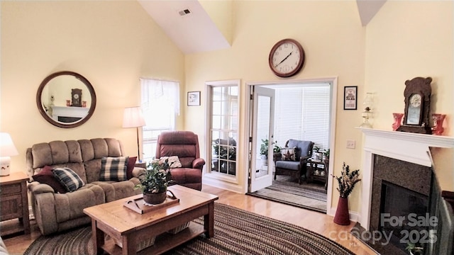 22 Florian Ln, Fletcher, NC 28732 - living room featuring a fireplace, wood finished floors, and lofted ceiling