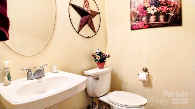 22 Florian Ln, Fletcher, NC 28732 - half bath featuring a sink and toilet