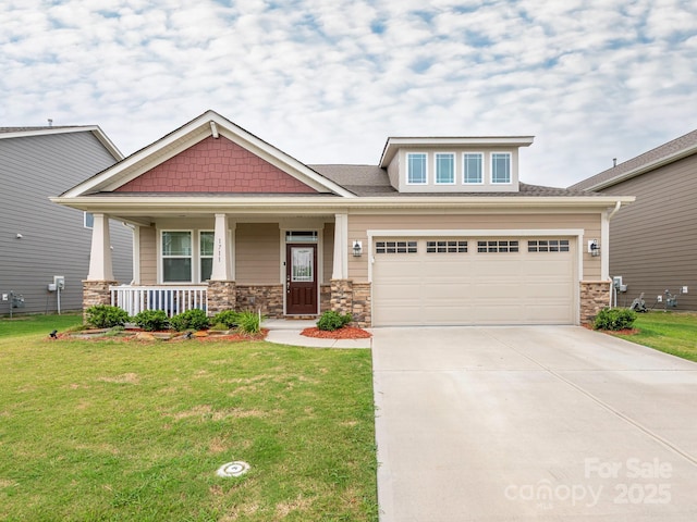 1711 Woodend Dr, Indian Trail, NC 28079 - craftsman-style home with concrete driveway, a front yard, covered porch, and stone siding