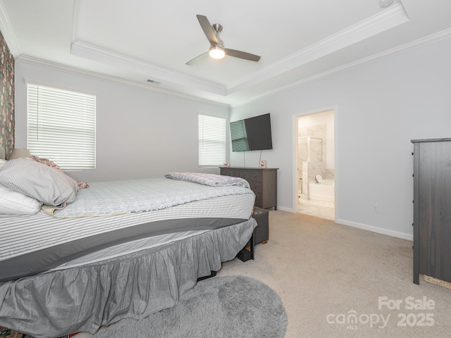 1711 Woodend Dr, Indian Trail, NC 28079 - bedroom with a raised ceiling, crown molding, light carpet, connected bathroom, and a ceiling fan