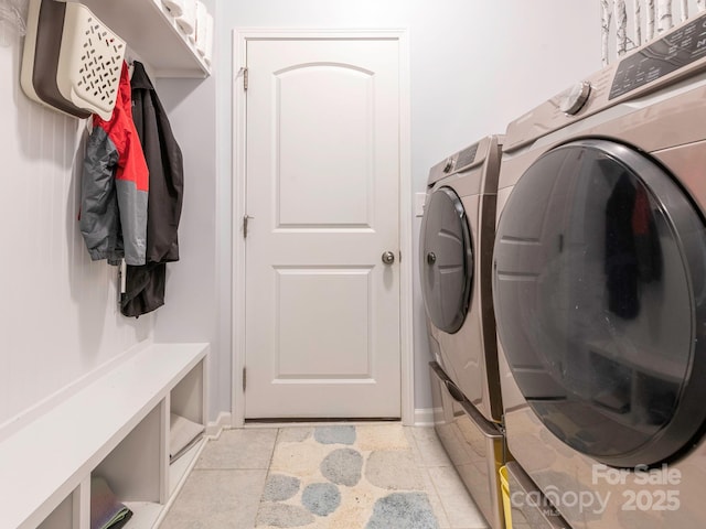 1711 Woodend Dr, Indian Trail, NC 28079 - laundry room featuring washer and dryer and baseboards