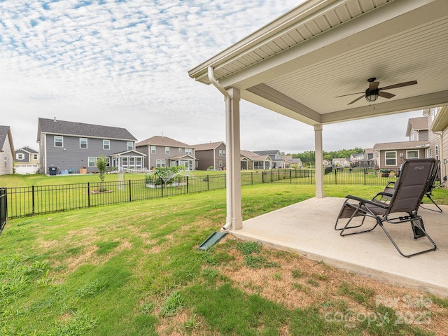 1711 Woodend Dr, Indian Trail, NC 28079 - fenced backyard with a residential view, ceiling fan, and a patio area
