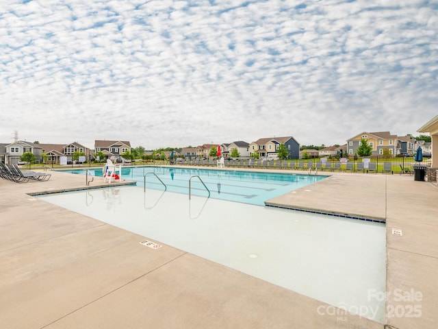 1711 Woodend Dr, Indian Trail, NC 28079 - community pool featuring a residential view and a patio