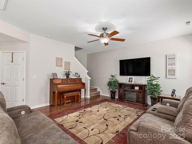 178 Black River Rd, Fletcher, NC 28732 - living area with wood finished floors, a ceiling fan, stairway, and a glass covered fireplace