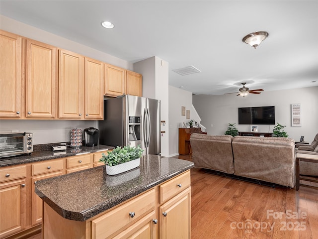 178 Black River Rd, Fletcher, NC 28732 - kitchen with stainless steel refrigerator with ice dispenser, light brown cabinets, ceiling fan, light wood-style flooring, and open floor plan