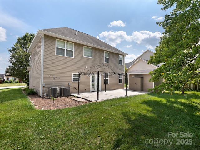 178 Black River Rd, Fletcher, NC 28732 - back of property with a patio, a yard, a garage, and a storage shed
