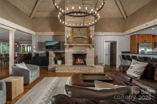 1648 Skyland Dr Unit 77, Seven Devils, NC 28604 - living area with high vaulted ceiling, a chandelier, wood walls, a wood ceiling with exposed beams, and a stone fireplace