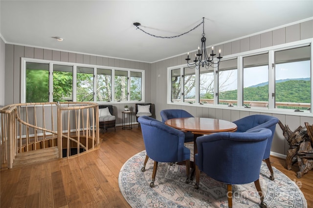 1648 Skyland Dr Unit 77, Seven Devils, NC 28604 - dining space featuring a chandelier, crown molding, and wood finished floors