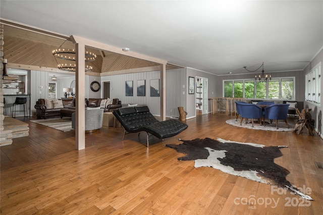 1648 Skyland Dr Unit 77, Seven Devils, NC 28604 - living room with a chandelier, wood-type flooring, and lofted ceiling