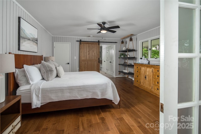 1648 Skyland Dr Unit 77, Seven Devils, NC 28604 - bedroom with ornamental molding, a barn door, wood finished floors, and ceiling fan