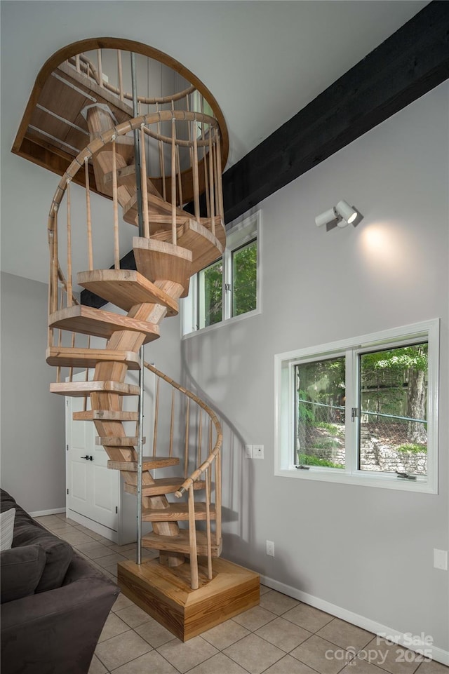 1648 Skyland Dr Unit 77, Seven Devils, NC 28604 - stairs with tile patterned floors and a towering ceiling