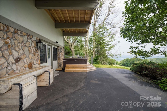 1648 Skyland Dr Unit 77, Seven Devils, NC 28604 - view of patio / terrace with a hot tub