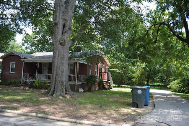 1125 Fries St, Salisbury, NC 28144 - view of front facade with covered porch and brick siding