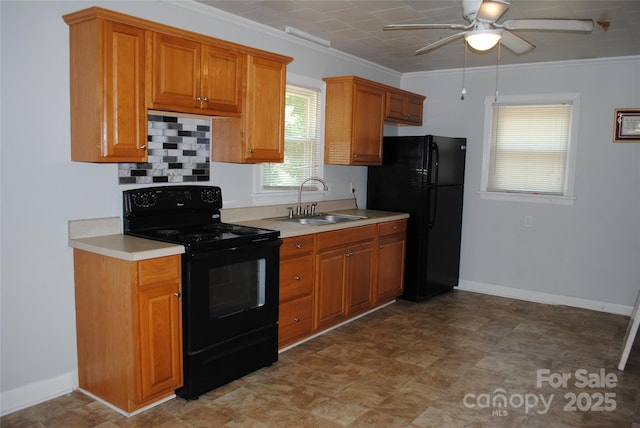 1125 Fries St, Salisbury, NC 28144 - kitchen with black appliances, ceiling fan, light countertops, brown cabinetry, and crown molding