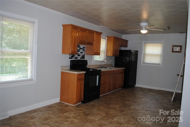 1125 Fries St, Salisbury, NC 28144 - kitchen featuring black appliances, ceiling fan, light countertops, ornamental molding, and brown cabinetry