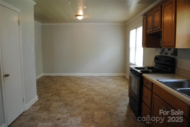 1125 Fries St, Salisbury, NC 28144 - kitchen featuring black electric range, crown molding, brown cabinetry, stone finish floors, and light countertops
