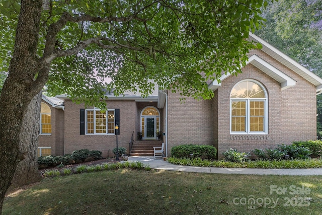 101 Citation Ln, Gastonia, NC 28056 - view of front facade with brick siding and a front yard