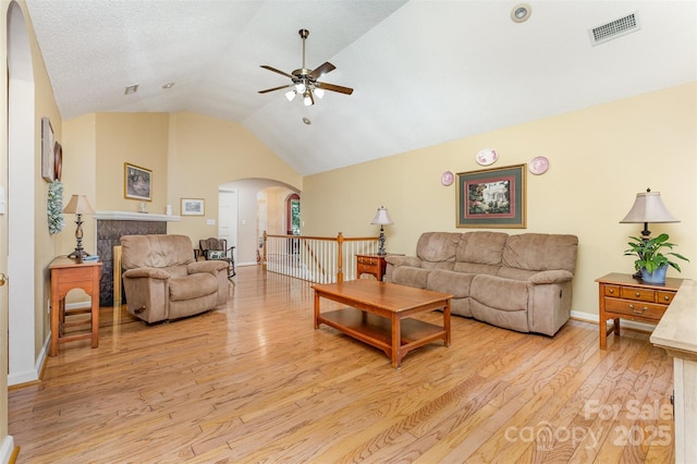 101 Citation Ln, Gastonia, NC 28056 - living room featuring arched walkways, a ceiling fan, light wood-style flooring, and high vaulted ceiling
