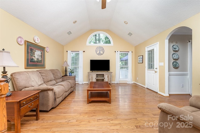 101 Citation Ln, Gastonia, NC 28056 - living room with light wood-style floors, vaulted ceiling, arched walkways, and a ceiling fan